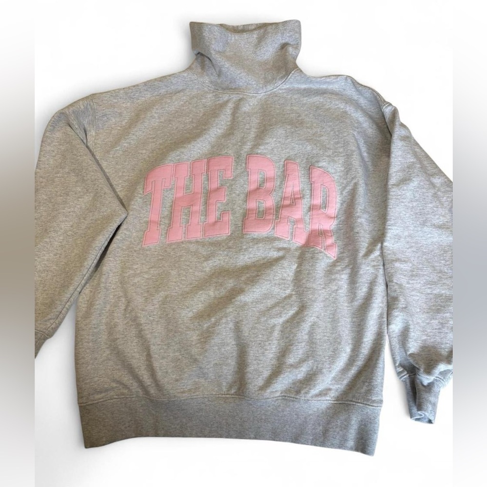 The Bar gray high neck sweatshirt with pink logo